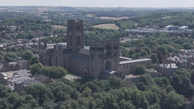 DURHAM, UK - AUGUST 2026: 4K scenic aerial shot of historic Durham Cathedral, Durham Castle, River Wear and cityscape in County Durham (M-Log Flat Profile)