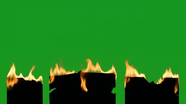 Row of small fires burning with orange flames against a green screen background