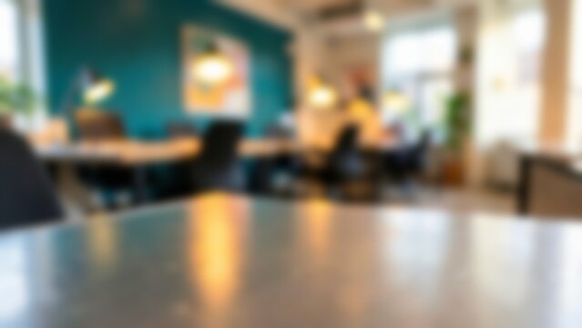 Empty desk surface foreground in blurred modern coworking office space for product placement mockups and virtual meeting backgrounds
