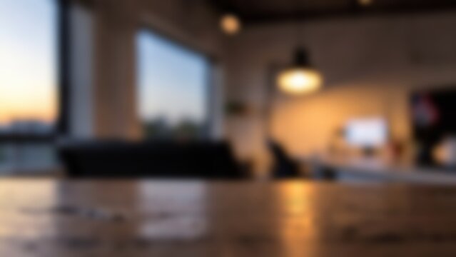 weathered cedar wood table surface in blurred modern home office interior setting designed for remote work product display mockups and professional web banner presentations