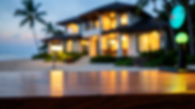 Empty tropical wooden desk surface against blurred luxury beachfront villa at twilight for premium product display and lifestyle advertising presentation