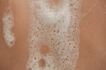 Fototapeta premium Close Up of Bath Foam on Skin During Bathing 