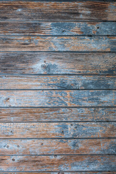Weathered Vintage Wooden Door with Faded Blue Paint and Rusty Nails