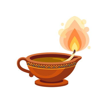 Traditional clay oil lamp with burning wick for religious festival celebration