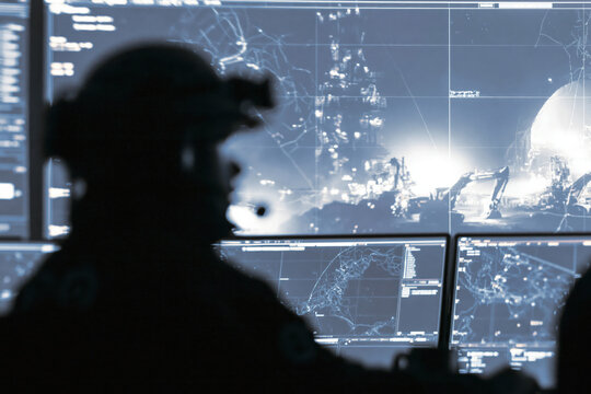 Security officer military control room tactical operation cyber security digital map surveillance monitor night mission command center intelligence analysis data network security officer military