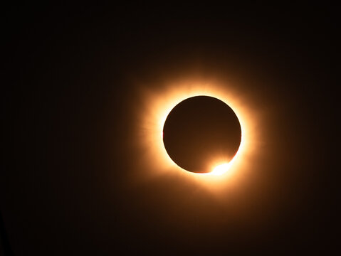 Villaferruena, Castile and Leon, Spain - 12 August 2026: View of a solar eclipse with the moon partially obscuring the sun, creating a bright ring of light in the dark sky.