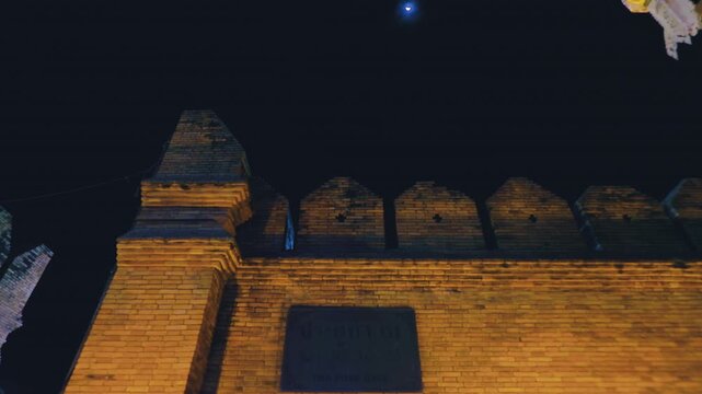 Night view of Tha Pae Gate with moon in Chiang Mai, Thailand