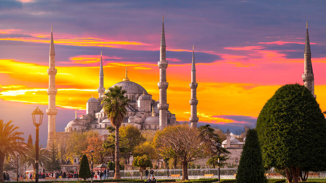 Majestic Blue Mosque at dramatic fiery sunset in Istanbul Turkey with copy space