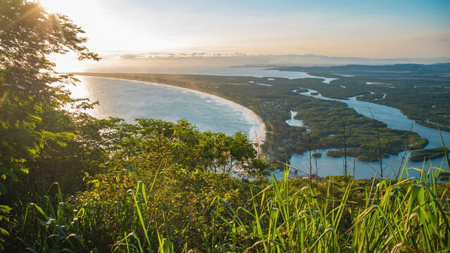  Panoramic view of Rio de Janeiro coastline with ocean and mangrove river at sunset