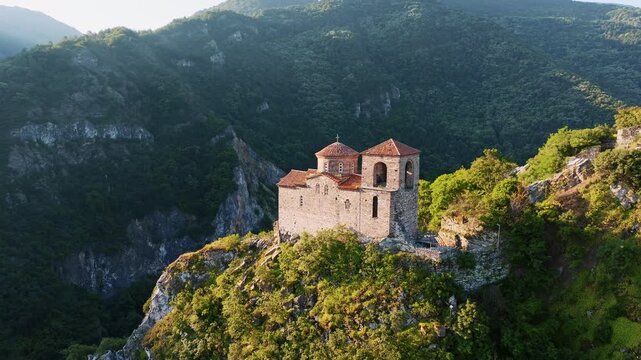 Asens Fortress Asenova Krepost medieval stone church cliff top mountain canyon aerial drone view Asenovgrad historic landmark landscape travel Bulgaria
