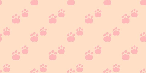 A sweet and simple seamless pattern of pink animal paw prints on a pale peach background. Excellent for feminine designs and gift wrap