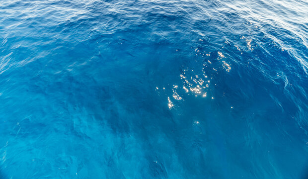 Artistic closeup deep blue sea rolling wave crystal water surface summer ocean texture minimal. Peaceful nature seascape landscape sunshine design. Meditation wellbeing backdrop scenic marine art