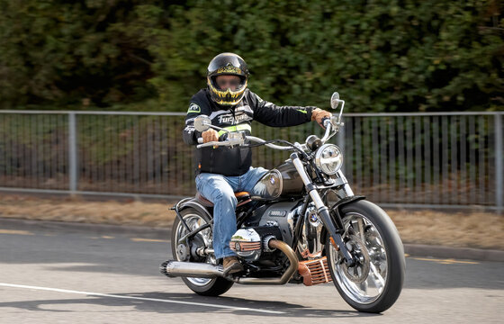 Milton Keynes,UK - Aug 2nd 2026:  Man riding a  2022 BMW r18 motorcycle driving on a British road