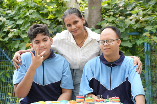 Special education teacher supporting two students with developmental disabilities during an inclusive educational activity using colorful learning toys, promoting social interaction, cognitive develop