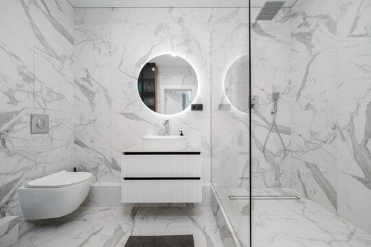 Calacatta marble tiles in walk-in shower bathroom