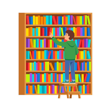 Young student standing on a step stool reaching for a colorful book on a large library bookshelf