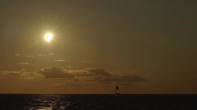 Windsurfer during partial Solar Eclipse