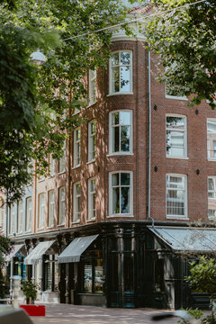 Charming brick building with large windows in city setting