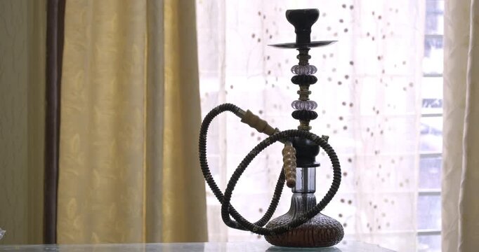 Decorative Hookah Shisha Pipe Displayed in Home Interior, Traditional Smoking Water Pipe and Stylish Home Decor