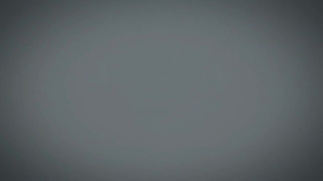 静かに明暗を繰り返すグレーの単色背景