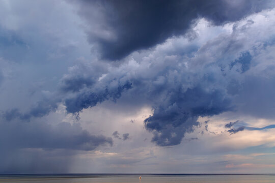 Dramatic dark storm clouds gathering over the sea in Dubulti, Jurmala, Latvia