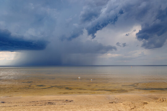 Rainstorm over the Baltic Sea and sandy Dubulti beach in Jurmala city on a Baltic Coast, Latvia