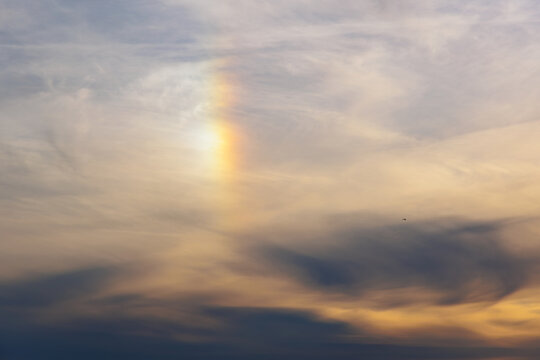 Sun dog in cloudy evening sky above Majori beach in Jurmala, Latvia