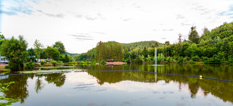 landscape scenery of the pond Camping du Muhlenbach, in Sturzelbronn, Northern Vosges Regional Nature Park (Lorraine, France) near the German border