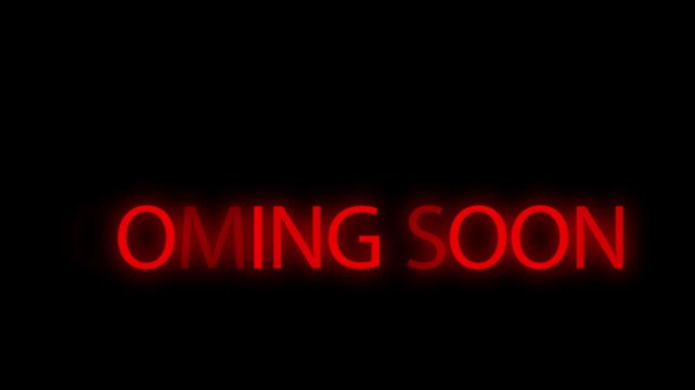 Red neon glowing text displaying a coming soon announcement against a black background.