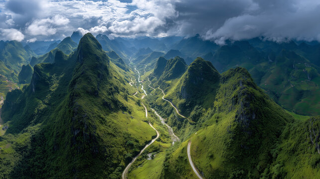 Panoramic aerial view of Ha Giang Loop mountain pass, winding roads through dramatic limestone peaks, clouds drifting over valleys, vibrant green landscape, ultra realistic drone photography, HDR, 8K