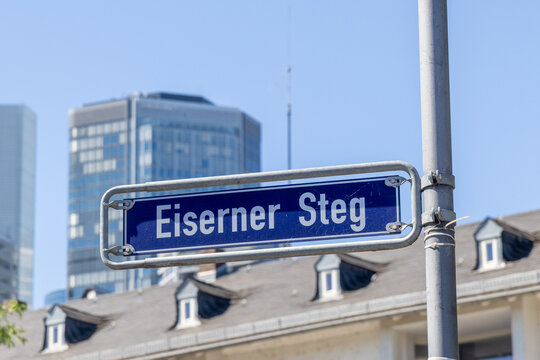 Street name Eisener STEG  in english iron footbridge in Frankfurt am Main on a blue enamel sign,