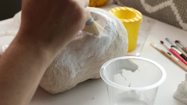Handmade papermache skull painting in Dia de los Muertos DIY craft workshop