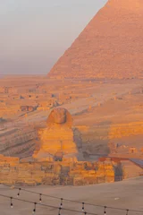 The Great Sphinx and the iconic Pyramid of Khafre in the Giza desert landscape © f11photo