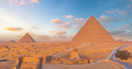 The Great Sphinx and the iconic Pyramid of Khafre in the Giza desert landscape © f11photo