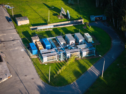 Aerial view of the data center facility located at the Riga Radio and Television Tower, featuring industrial cooling units and technical infrastructure in Riga, Latvia.