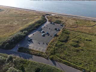 Aerial drone 4K view of Leasowe beach edge meeting warm sunlit greenland Leasowe Wirral © Wirral Views