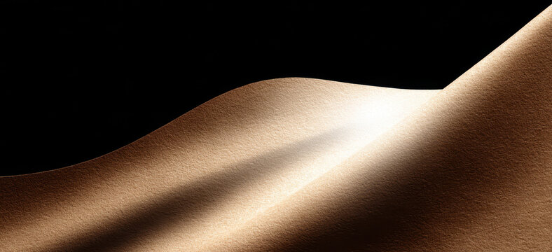 Smooth, illuminated beige brown fabric with soft curves and shadows against dark background. Abstract geometric banner background