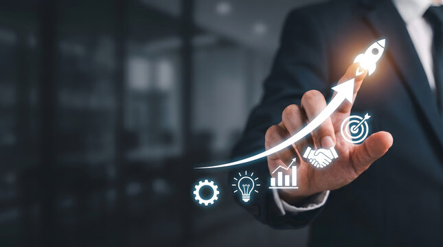 Businessman touching virtual rocket launch hologram with glowing business strategy icons, Corporate business startup and growth concept with digital rocket and financial success icons.