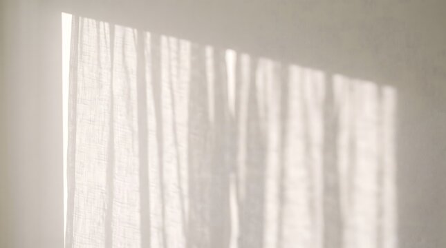 Sunlight and shadow of curtains on a beige wall, abstract background