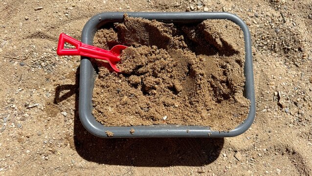 Sandbox with a Shovel on a Playground