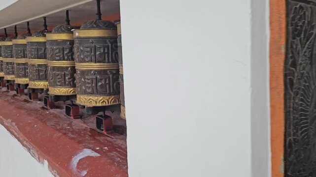 Large Tibetan Buddhist Prayer Wheels, Ornate Mani Wheels with Buddhist Mantras Along Temple Walkway, Spiritual Religious Practice, Buddhism, Himalayan Culture and Heritage