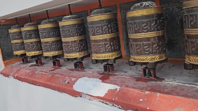 Large Tibetan Buddhist Prayer Wheels, Ornate Mani Wheels with Buddhist Mantras Along Temple Walkway, Spiritual Religious Practice, Buddhism, Himalayan Culture and Heritage