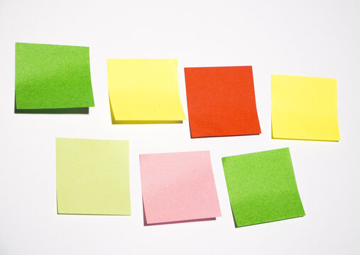 lots of blank square paper multicolored sticky notes isolated on white  close up. Colorful bank Memo Sticky Notes Pape isolated on white background with clipping path. Simple Square  business or edu