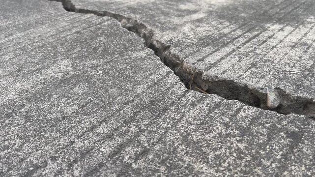 Longitudinal Deep Crack on Damaged Concrete Road