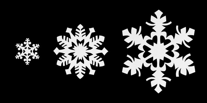 Paper cut snowflakes set isolated on black background. Collection of three unique hand carved kirigami snowflake ornaments for Christmas craft and winter holiday New Year decoration. Elements