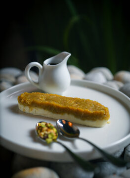 Turkish traditional dessert kunefe,kunafa, kadayif, Traditional Eastern dessert with cheese, luxurious kunafa ice cream dessert, Sweet cheese pastry, kunafa served on a plate