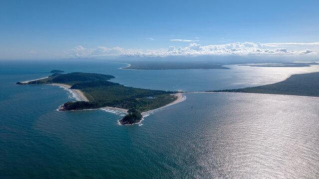 Aerial view of Ilha do Mel surrounded by the Atlantic Ocean, featuring sandy beaches, lush green vegetation, and rocky coastlines in Paranagua, State of Parana, Brazil.