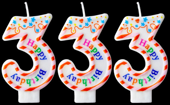 Number three hundred thirty-three shaped birthday candles with colorful sprinkles and Happy Birthday text isolated on a black background