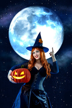 Witch on Halloween. Female wizard fairy character for All Saints' Day. Fantasy gothic red-haired Vampire girl in black dress. Enchantress dressed in carnival costume