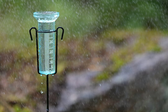 Rain Gauge Measuring Heavy Rainfall in Garden